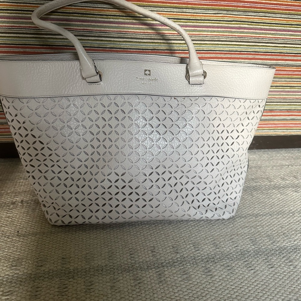 Kate Spade cream leather laser cut tote.